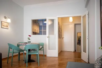 a dining room with a table and chairs at Blue Ark Acropolis Light in Athens