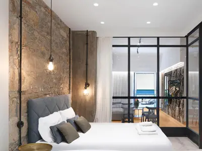 a bedroom with a large bed and a large window at 5 star lux suite in Kolonaki. in Athens