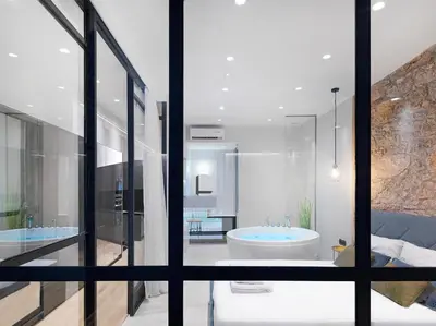 a bathroom with two sinks and a tub at 5 star lux suite in Kolonaki. in Athens