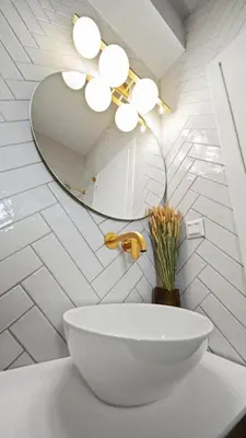a bathroom with a sink and a mirror at Luxurious Apartment with Big Sea View Terrace - Central Location in Athens