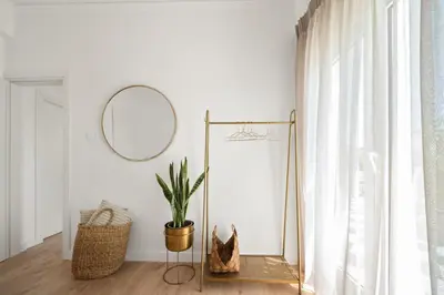 a room with a mirror and a potted plant at Luxurious Apartment with Big Sea View Terrace - Central Location in Athens