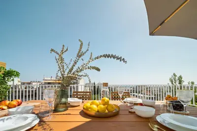 a table with a bowl of fruit on a balcony at Luxurious Apartment with Big Sea View Terrace - Central Location in Athens