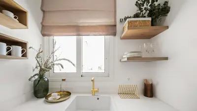 a white kitchen with a sink and a window at Luxurious Apartment with Big Sea View Terrace - Central Location in Athens