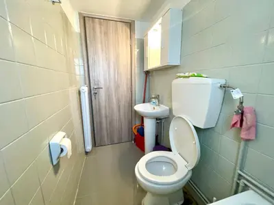 a small bathroom with a toilet and a sink at Luxury Flat in Hilton, 3' from metro, VFM! in Athens