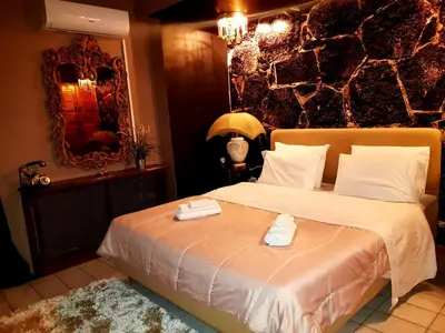 a bedroom with a bed with two trays on it at Kouro's private room! in Piraeus