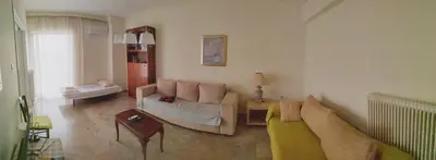 a living room with a couch and a table at Vangelis apartment near Athens Airport in Spáta