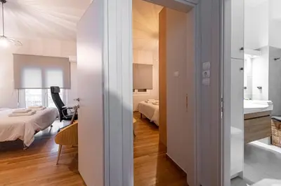 a small apartment with a bedroom and a bathroom at Alopece City Apartment - Kolonaki in Athens