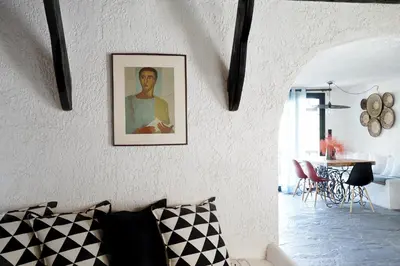 a living room with a picture of a man on the wall at Villa Xenia&Akis in Athens