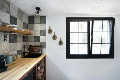 a kitchen with a sink and a window at Villa Xenia&Akis in Athens