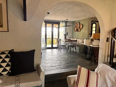 a living room with a couch and a table at Villa Xenia&Akis in Athens