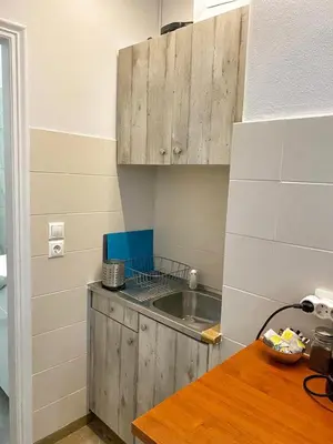 a small kitchen with a sink and a counter at Check Point - Museum in Athens