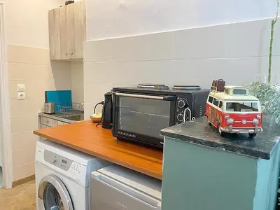 a microwave sitting on top of a counter in a kitchen at Check Point - Museum in Athens