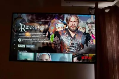 a flat screen tv with a picture of thor on it at Urban Downtown Studio Back in Athens