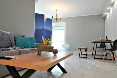 a living room with a couch and a coffee table at Athens Central 3BD Apartment next to Metro Luxury in Athens