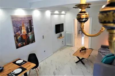 a living room with a couch and a table at Athens Central 3BD Apartment next to Metro Luxury in Athens