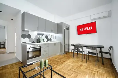a kitchen and dining room with a table and chairs at Majestic Flat with Huge Terrace in the City Center in Athens