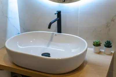 a white sink with a faucet in a bathroom at Majestic Flat with Huge Terrace in the City Center in Athens