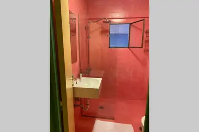 a bathroom with a sink and a shower at Villa Kunterbunt in Athens