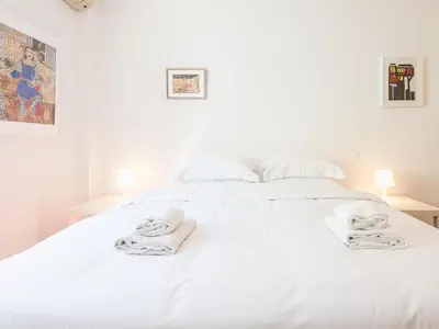 a white bed with towels on top of it at Welcome to Lumen Villa the first of the Adelos Trilogy in Athens