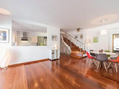 a dining room and living room with a table and chairs at Welcome to Lumen Villa the first of the Adelos Trilogy in Athens