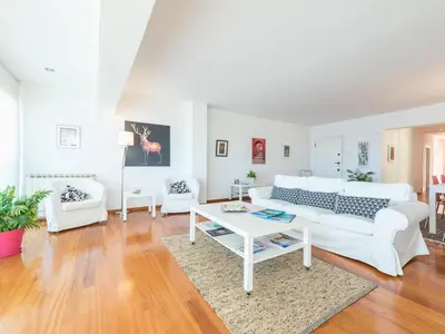 a living room with a white couch and a table at Adelos Coastal Chic by the Sea - Athens Riviera in Athens