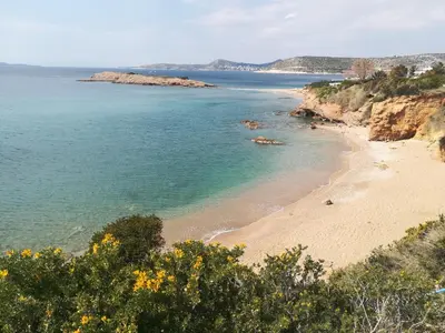 a beach on the side of a cliff at Studio Agia Marina Koropi in Aghia Marina