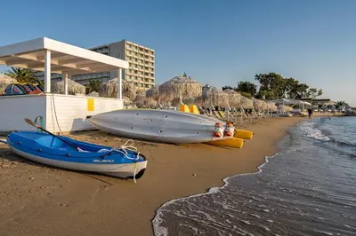 a beach with three boats on the sand at Kavouri Seaside Luxury Bungalow in Athens
