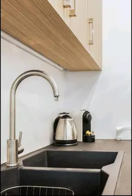 a kitchen sink with a tea kettle on it at Fashionable Base in Central Athens in the Old Tailor Factory in Athens