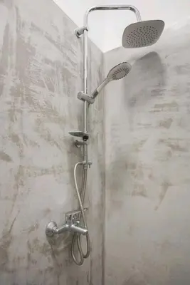 a shower with a shower head in a bathroom at Fashionable Base in Central Athens in the Old Tailor Factory in Athens