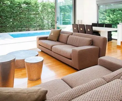a living room with a couch and a table at Ultra-Modern Living, Luxe 4BR with Private Outdoor Pool in Athens