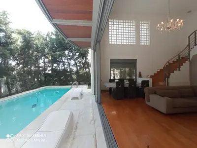 a house with a swimming pool and a living room at Ultra-Modern Living, Luxe 4BR with Private Outdoor Pool in Athens