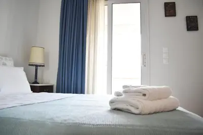 a bedroom with a bed with towels on it at Skip Away from the Acropolis Museum by Athenian Homes in Athens
