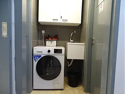 a washer and dryer in a small room at Athena Βright & New Studio - 25' walk to the Acropolis in Athens