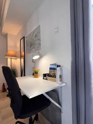 a white desk with a black chair in a room at Hermes New & Comfy Studio - 25' walk to the Acropolis in Athens