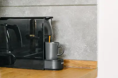 a coffee pot sitting on top of a counter at Erato by Heloni Apartments in Athens