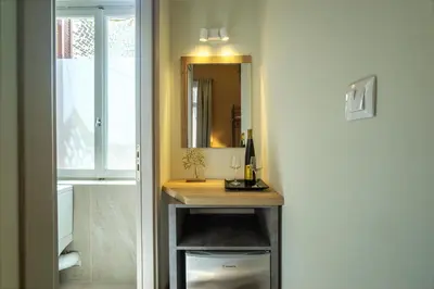 a bathroom with a sink and a mirror at Karma Athens in Athens