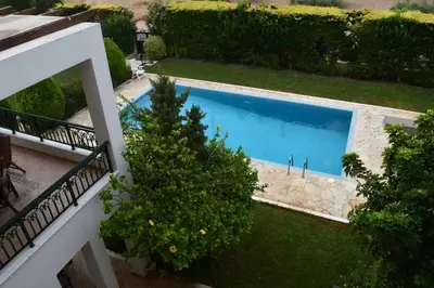 an overhead view of a swimming pool in a yard at Seaside Villa Lagonisi in Kalívia Thorikoú