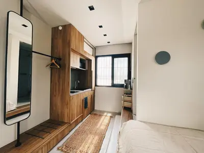 a bedroom with a bed and a window at Acropol Studio Loft with amazing view & terrace in Athens