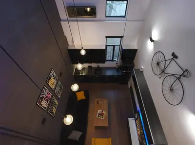 an overhead view of a room with a bike on the wall at 200 Mb fibre remote workers' Dreamhouse in Athens