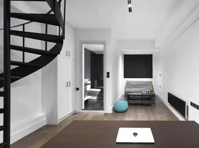 a room with a staircase and a living room with white walls at 200 Mb fibre remote workers' Dreamhouse in Athens