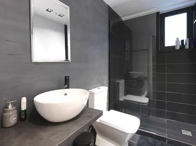 a bathroom with a white sink and a toilet at 200 Mb fibre remote workers' Dreamhouse in Athens