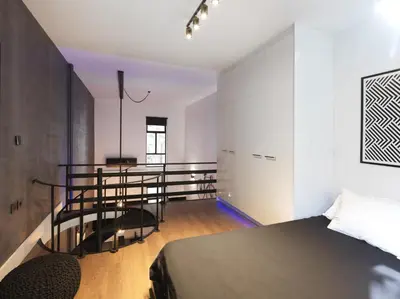 a bedroom with a bed and a dining room at 200 Mb fibre remote workers' Dreamhouse in Athens