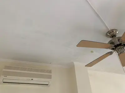 a ceiling fan in a room with a white ceiling at PortoRafti seaview garden Villa in Porto Rafti