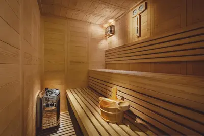 a sauna with a tub and a bucket in it at The Residence Aiolou Hotel & Spa in Athens
