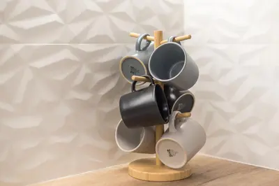a group of coffee cups on a wooden holder at Stylish Luxury Apartment at Ampelokipi Metro station in Athens