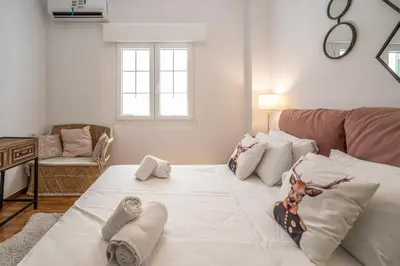 a living room with a couch and a table at Athens Gift, only 300m from Acropolis Museum in Athens
