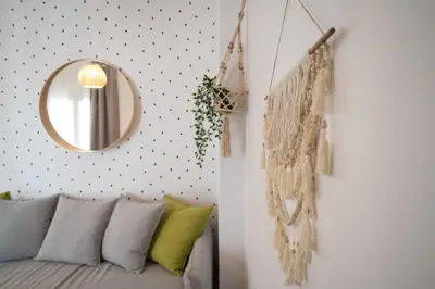 a room with a couch and a mirror at Athens Gift, only 300m from Acropolis Museum in Athens