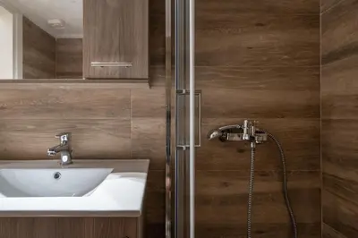 a bathroom with a sink and a shower at Athens Gift, only 300m from Acropolis Museum in Athens