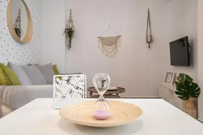 a wooden plate with a glass on top of a table at Athens Gift, only 300m from Acropolis Museum in Athens