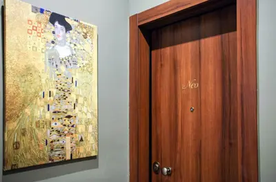 a painting on the wall next to a door at Neo Luxury Suite in Athens